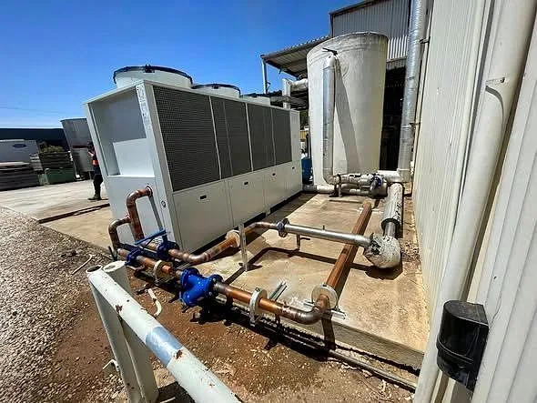 A bank of commercial air conditioning and cooling units installed by Classic Air and Mechanical Services