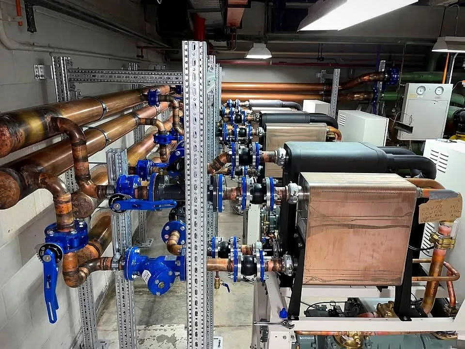 Copper chilled-water pipework and blue valves in a commercial plant room installed by Classic Air and Mechanical Services