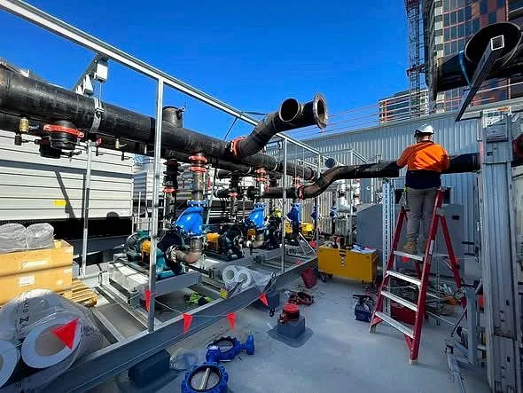 Commercial rooftop chilled-water plant and mechanical pipework installed by Classic Air and Mechanical Services